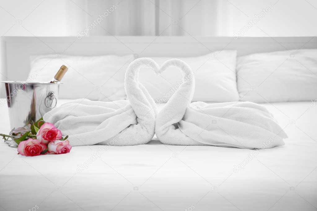 Romantic hotel suite with roses and champagne