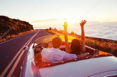 Couple in a Mercedes SLK on a Swiss alpine pass